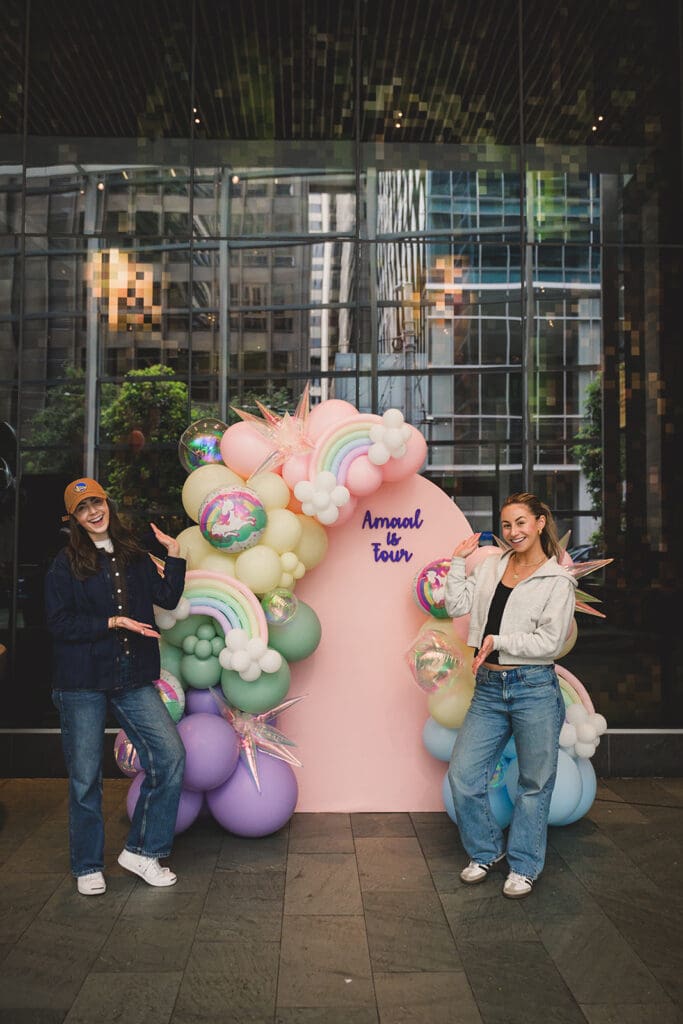 Portraits of two ladies, founder of Bay Area Party Girl Company posing in front of their balloon decor creation at a private party in downtown San Francisco.
