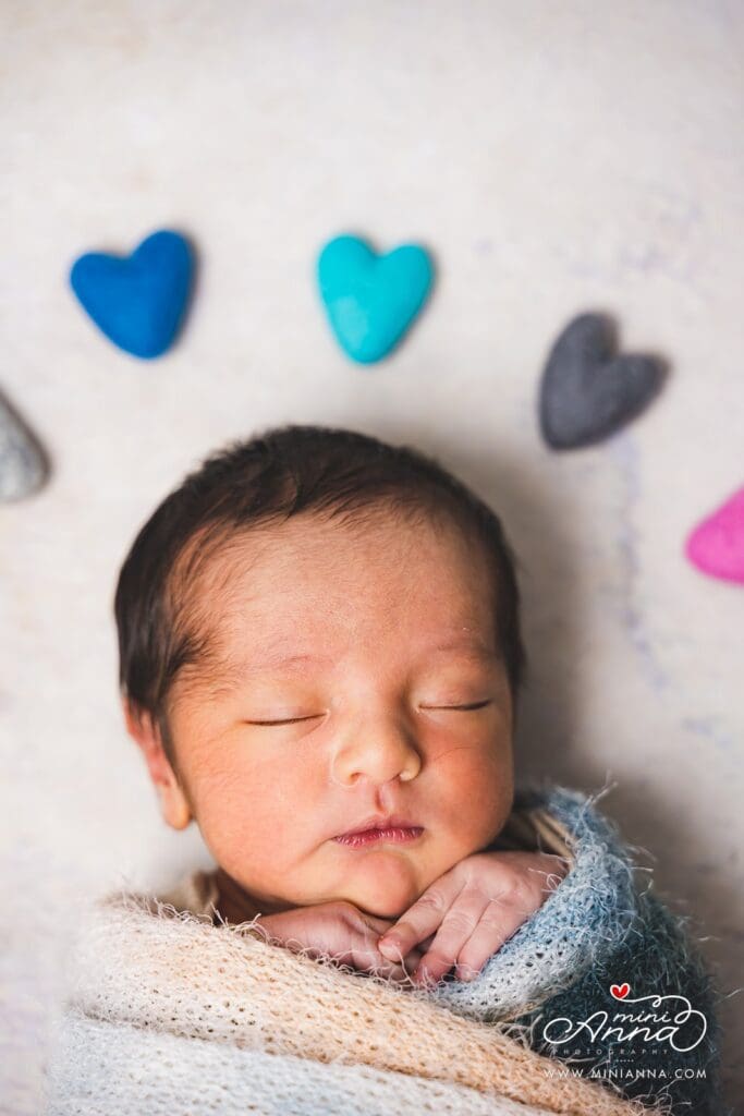 Sleeping baby in basket for newborn photoshoot