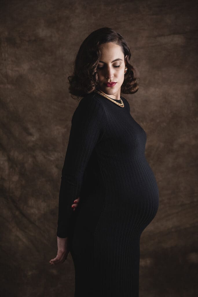 Silhouette of pregnant woman at sunset