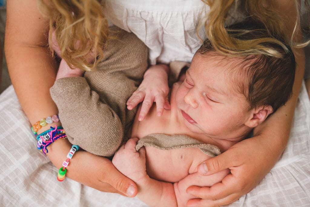 Young baby poses for studio session with mom