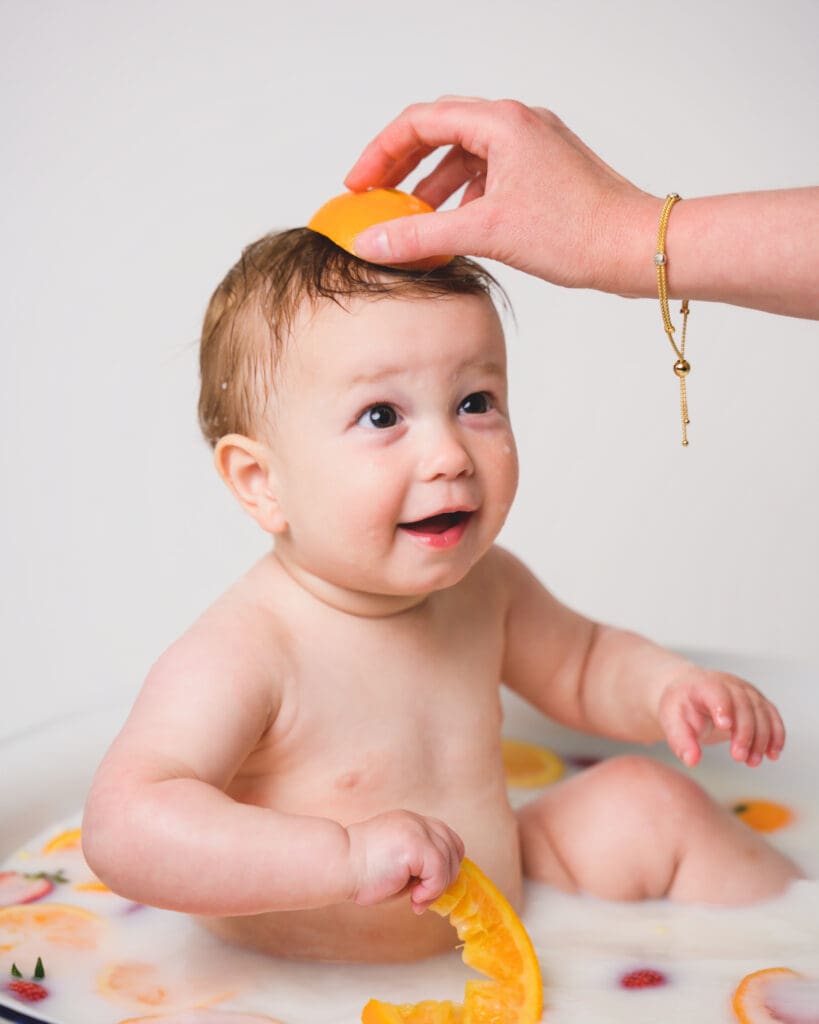 Milkbath maternity shoot with floral accents