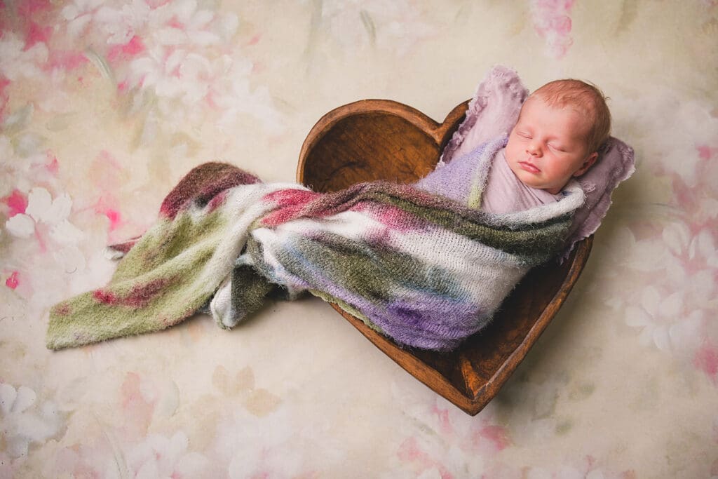 Cozy newborn photography setup with curated props