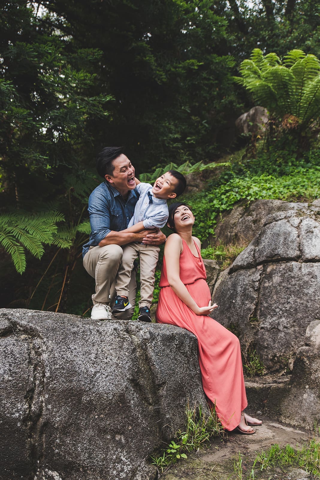 Playful family photo session at Blue Heron Lake in Golden Gate Park with water views, a cute white bridge and tree line paths. 