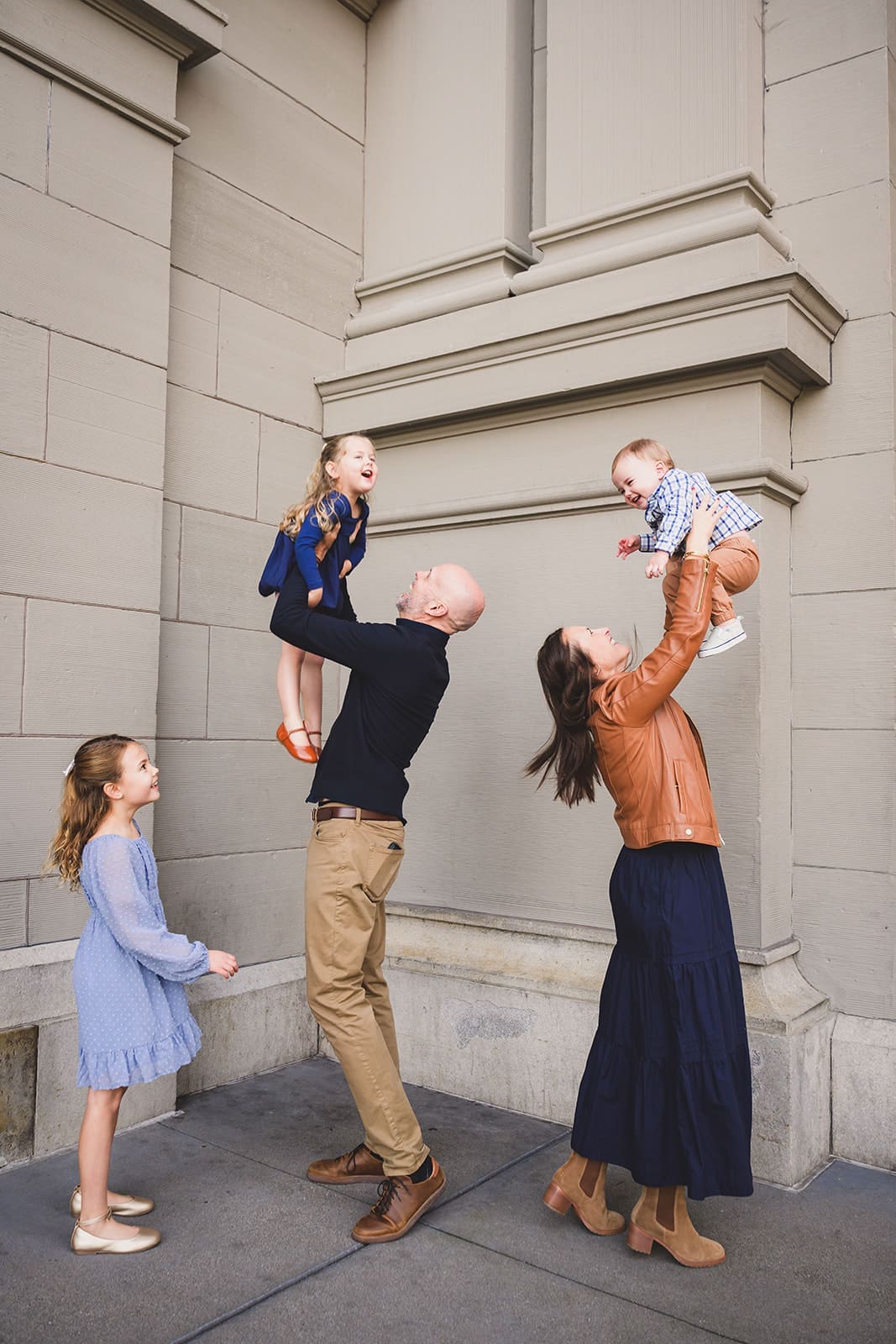  Family photos at the San Francisco Ferry Building with three young children playing along the Embarcadero | Mini Anna Photography