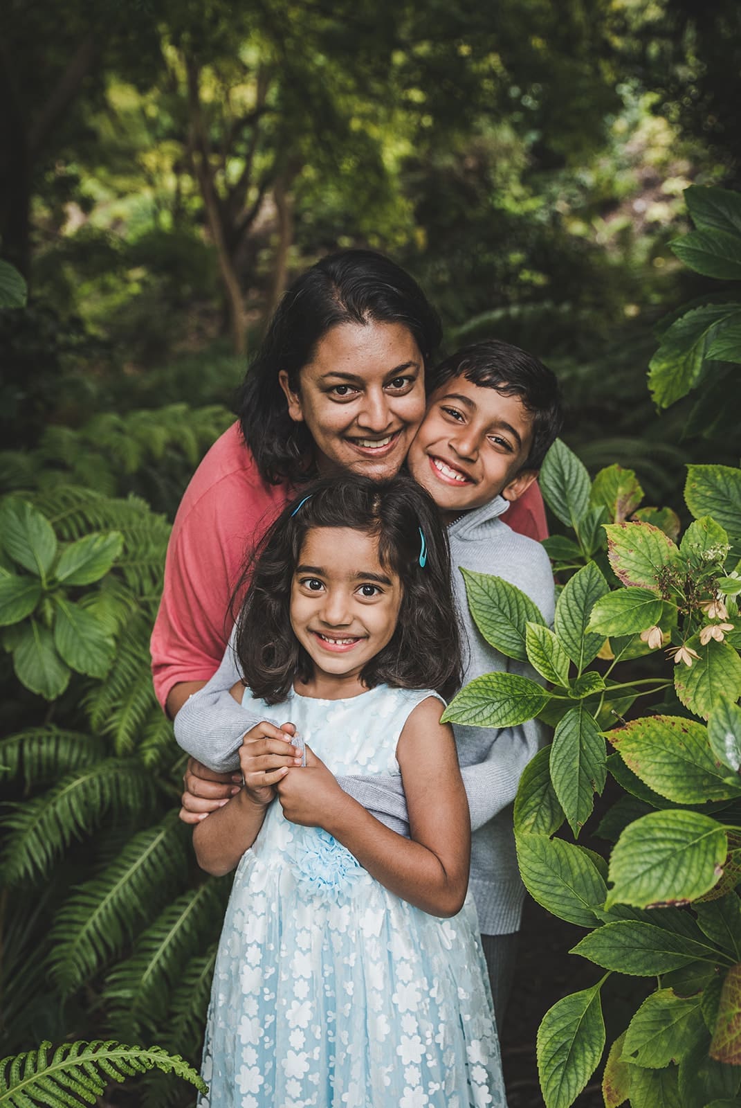 Family photography session at San Francisco Botanical Garden with lush greenery and kids exploring garden paths