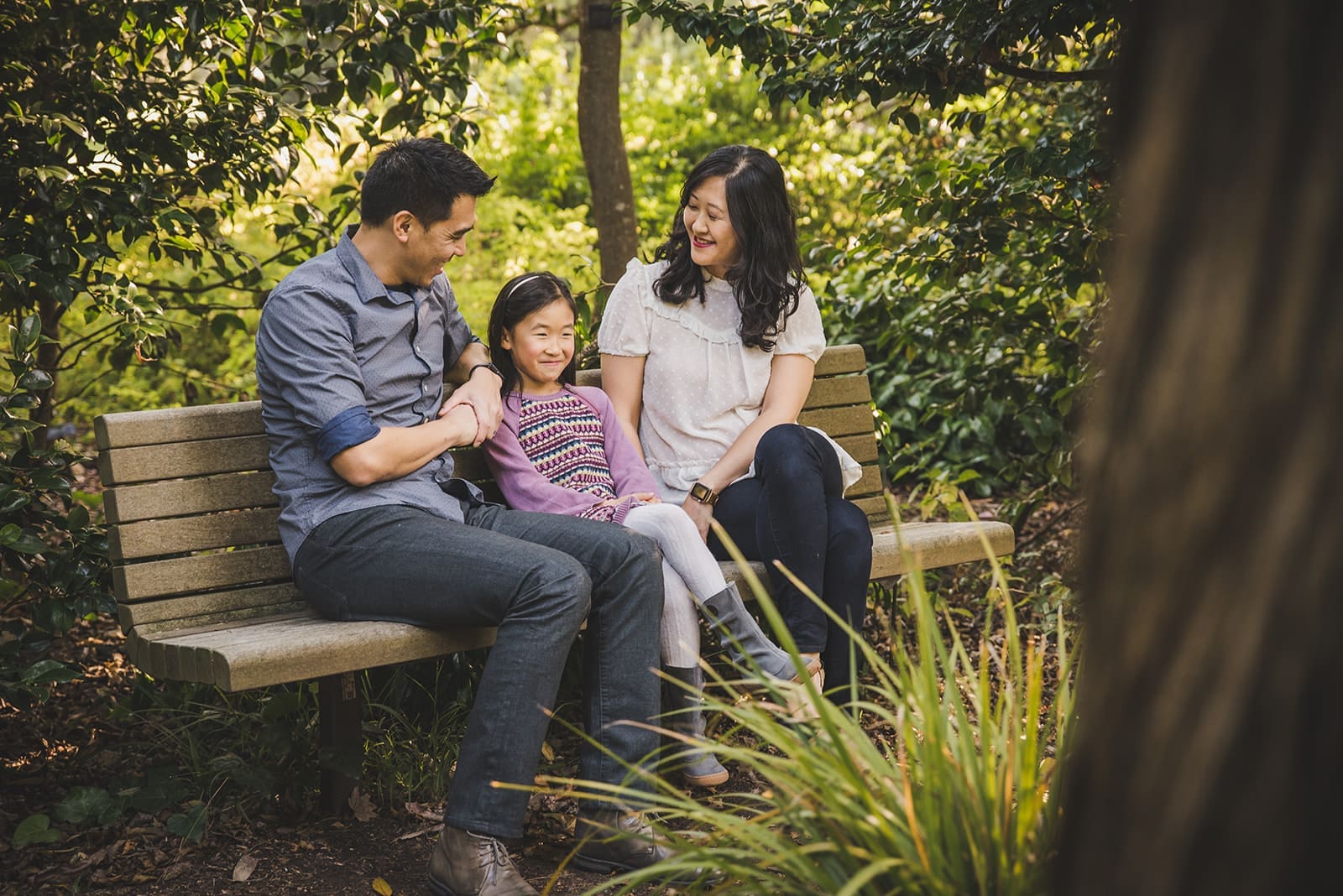 Family photography session at San Francisco Botanical Garden with lush greenery and kids exploring garden paths