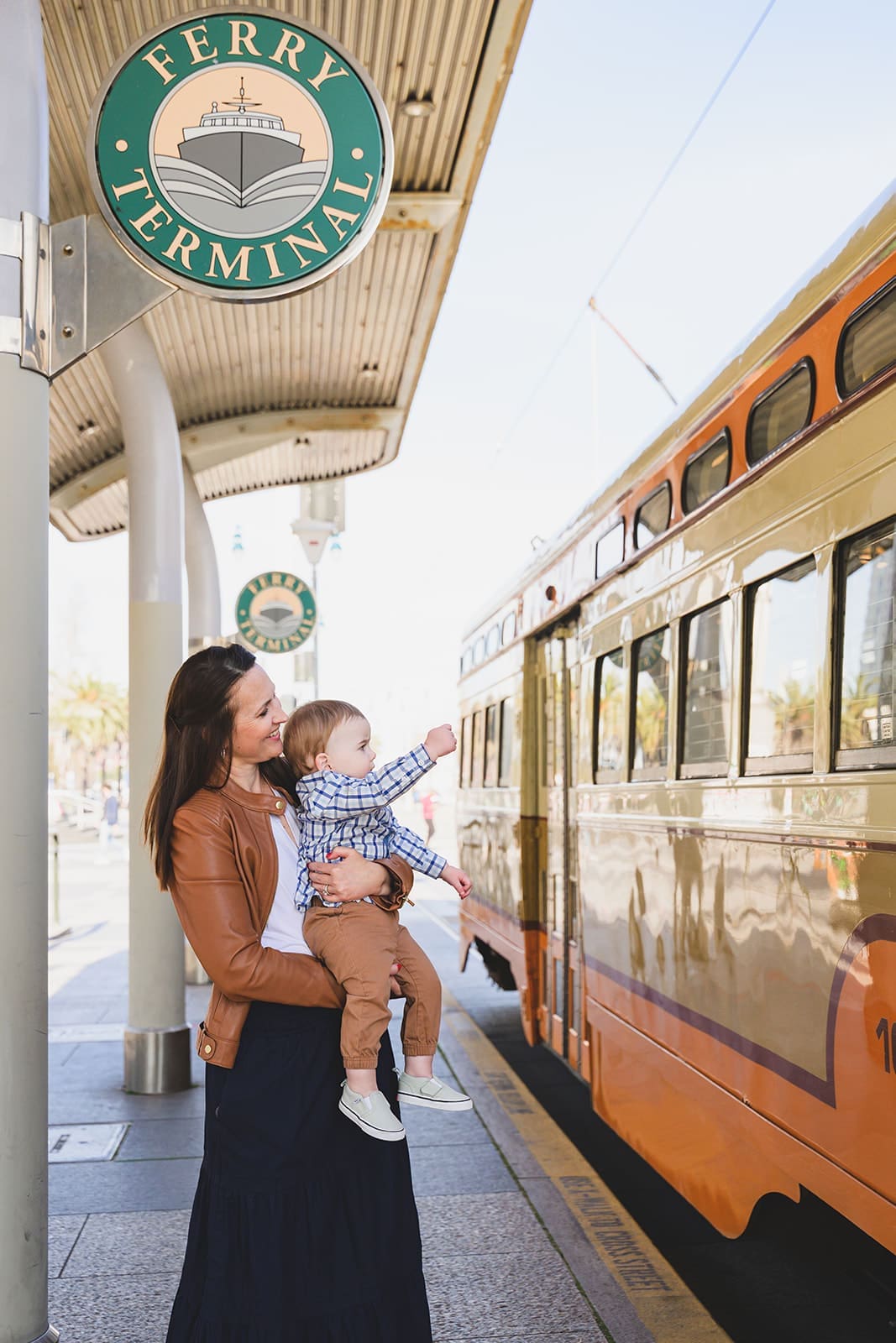  Family photos at the San Francisco Ferry Building with three young children playing along the Embarcadero | Mini Anna Photography