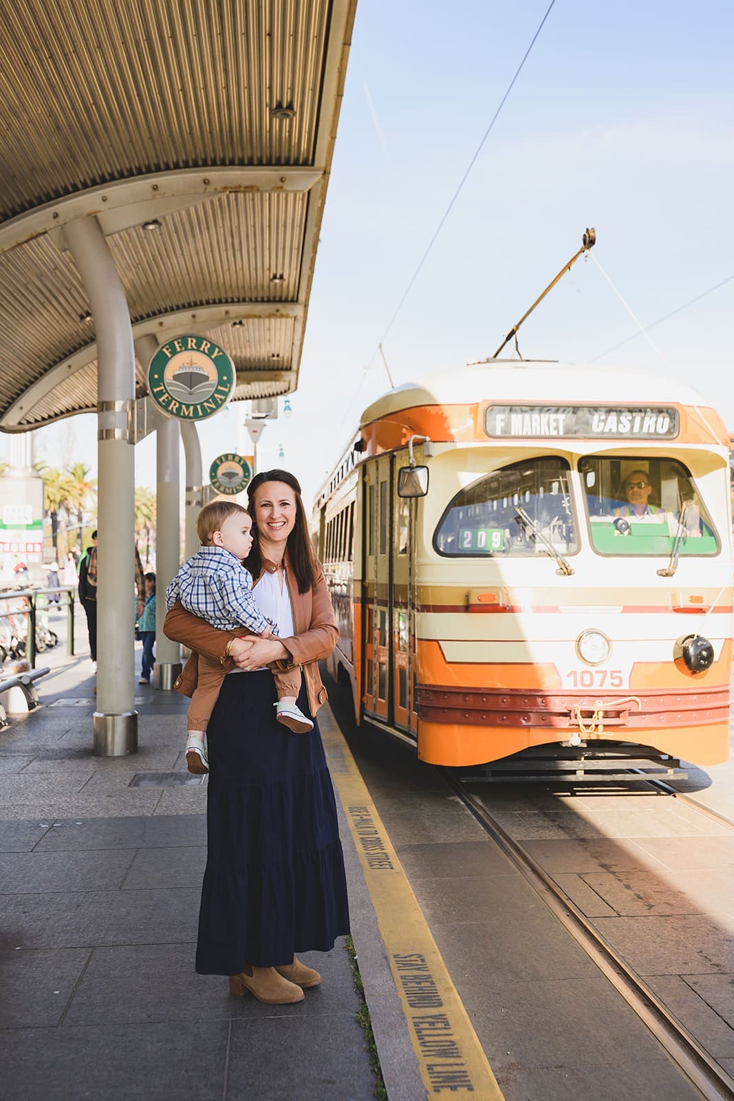  Family photos at the San Francisco Ferry Building with three young children playing along the Embarcadero | Mini Anna Photography