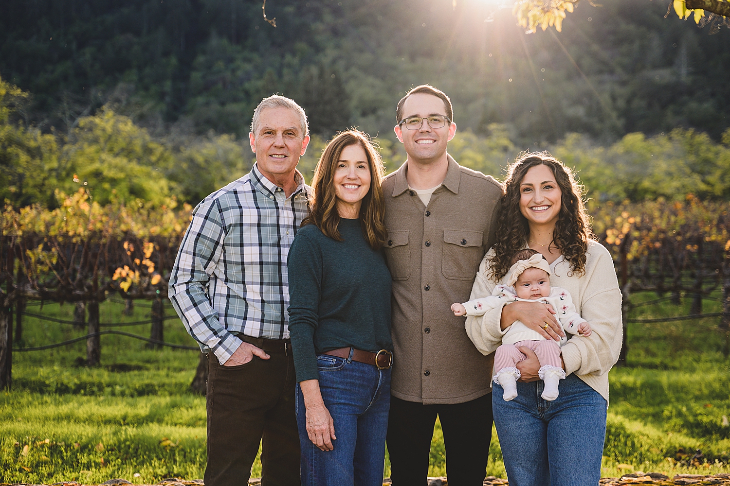four adults and one baby in a vineyard during golden hour by Mini Anna Photography