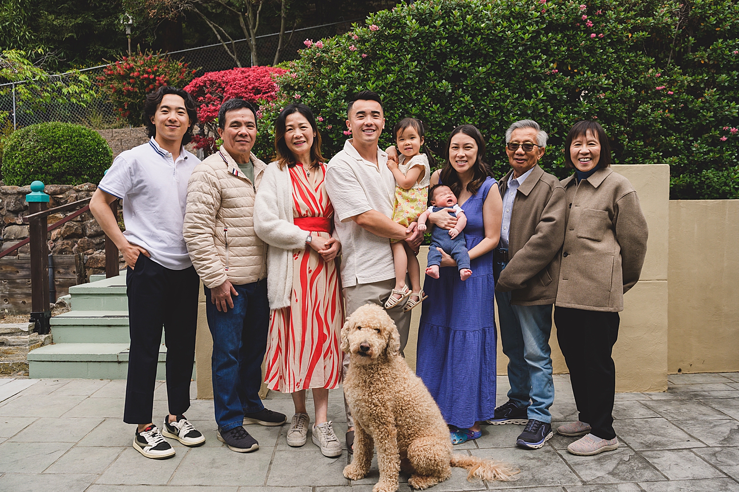 extended family on a porch showing when to Book Your Newborn Photographer